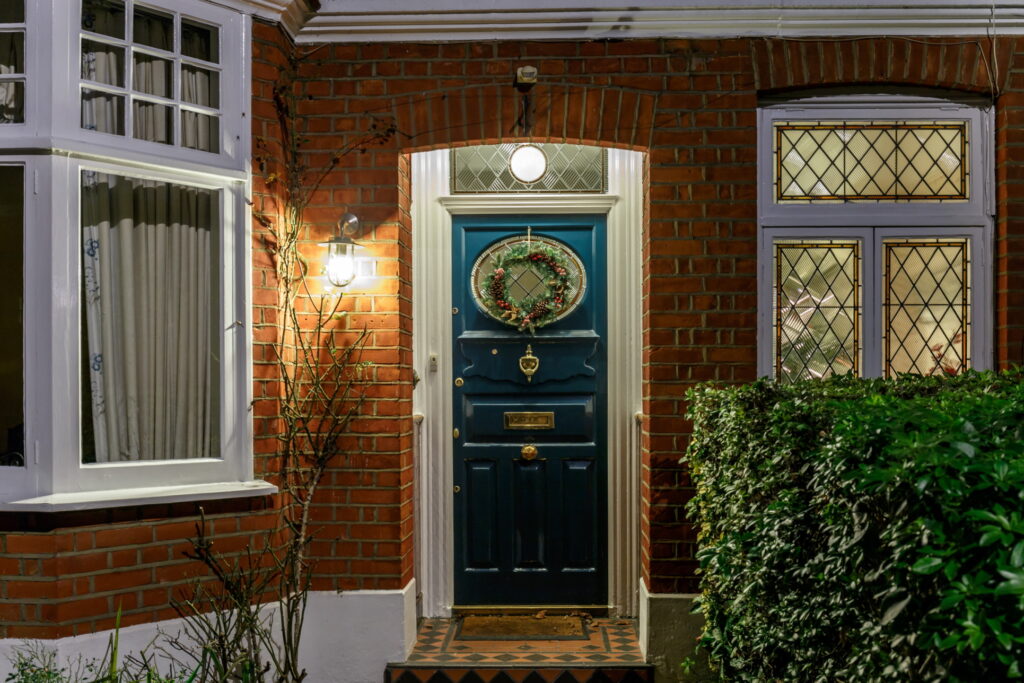Front door of home with welcoming lights